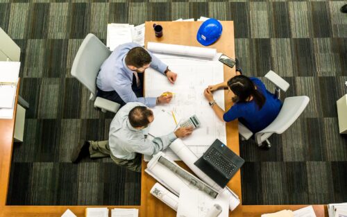 Picture shows a group of people meeting to discuss something.